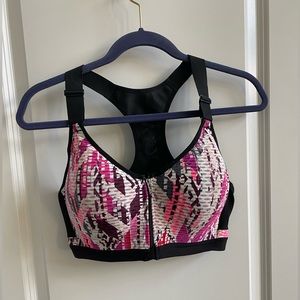 VSX Sport Bra. Size 38 D. Multicolored with black zip up front.